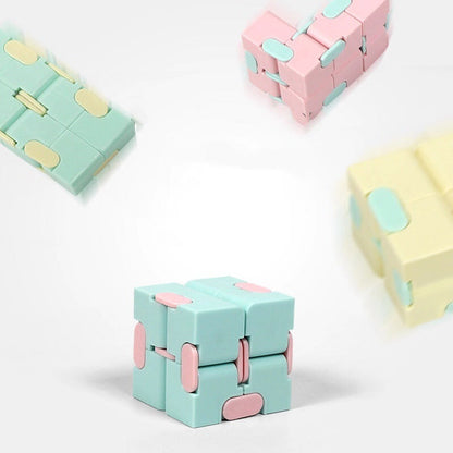 Infinity Cube finger puzzle with 8 rotating cubes, compact stress-relief toy in random colors.