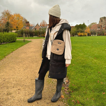Mini dog walking bag in tan waterproof nylon, crossbody design with zip compartments & poo bag dispenser