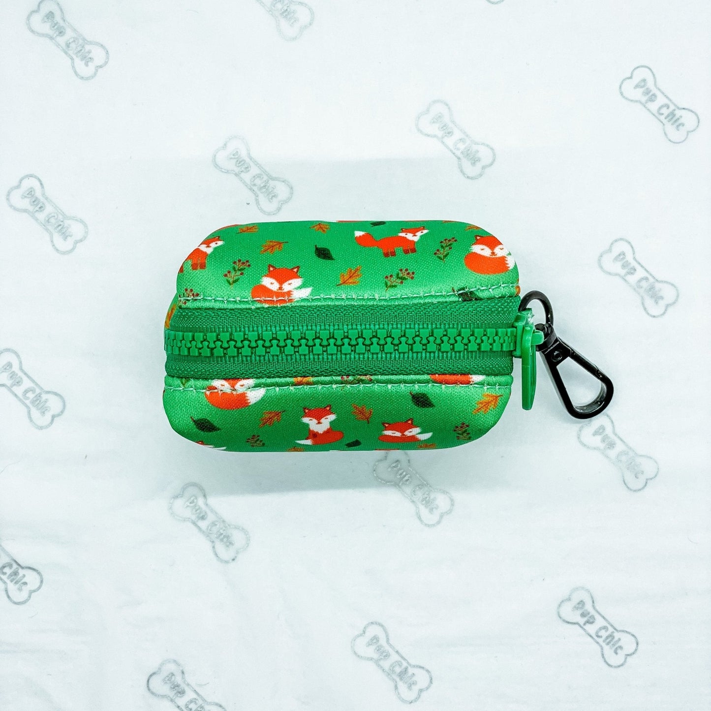 Inquisitive Fox clip‑on poo bag holder with colourful fox print, fits rolls, treats, and keys
