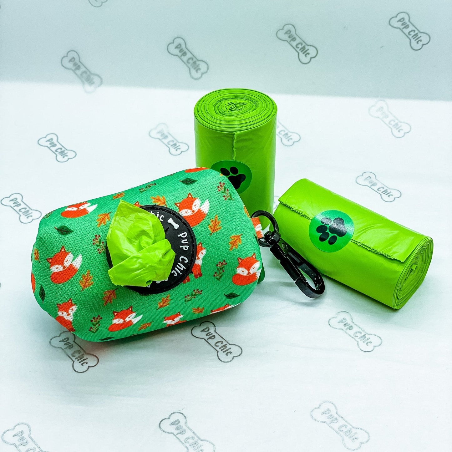 Inquisitive Fox clip‑on poo bag holder with colourful fox print, fits rolls, treats, and keys