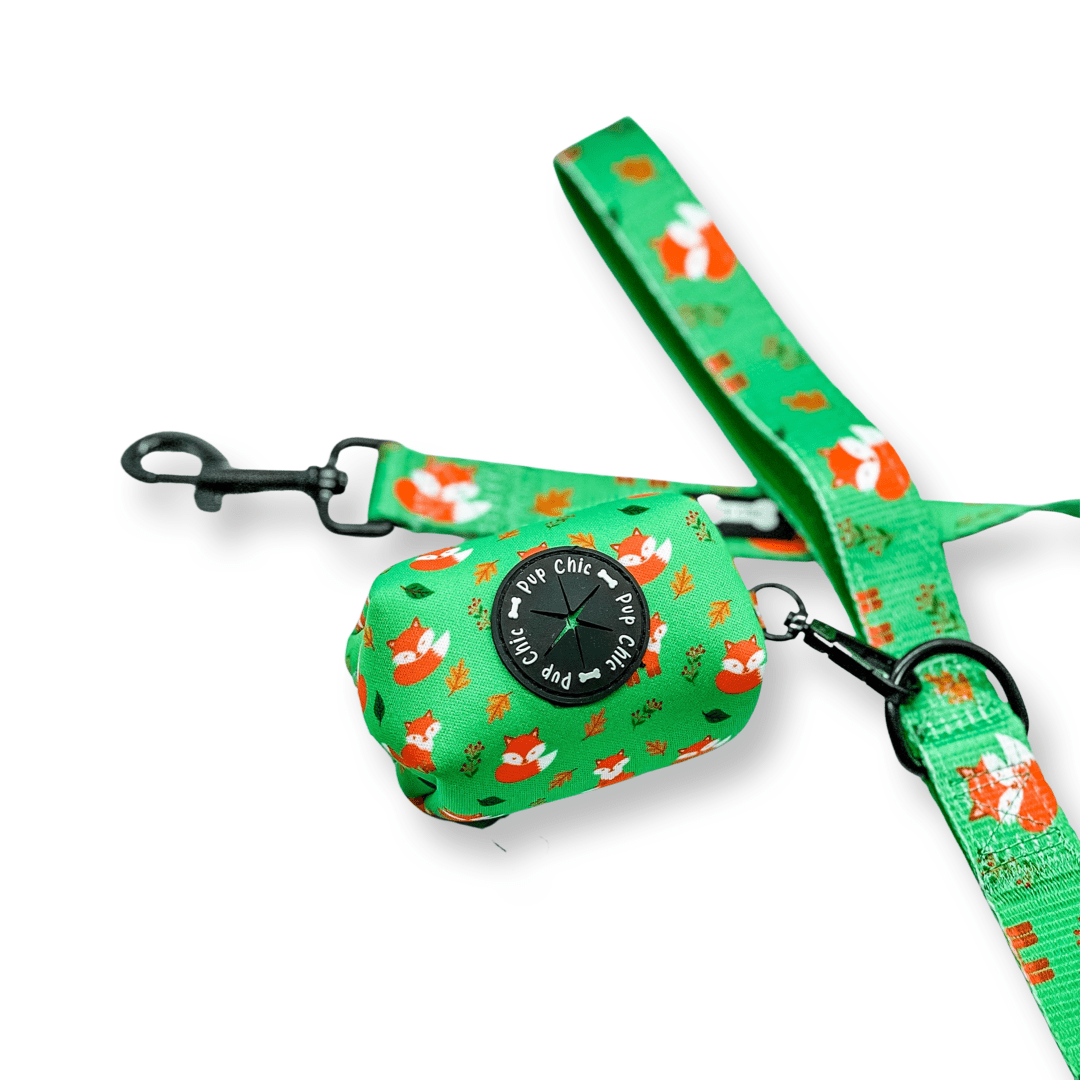 Inquisitive Fox clip‑on poo bag holder with colourful fox print, fits rolls, treats, and keys