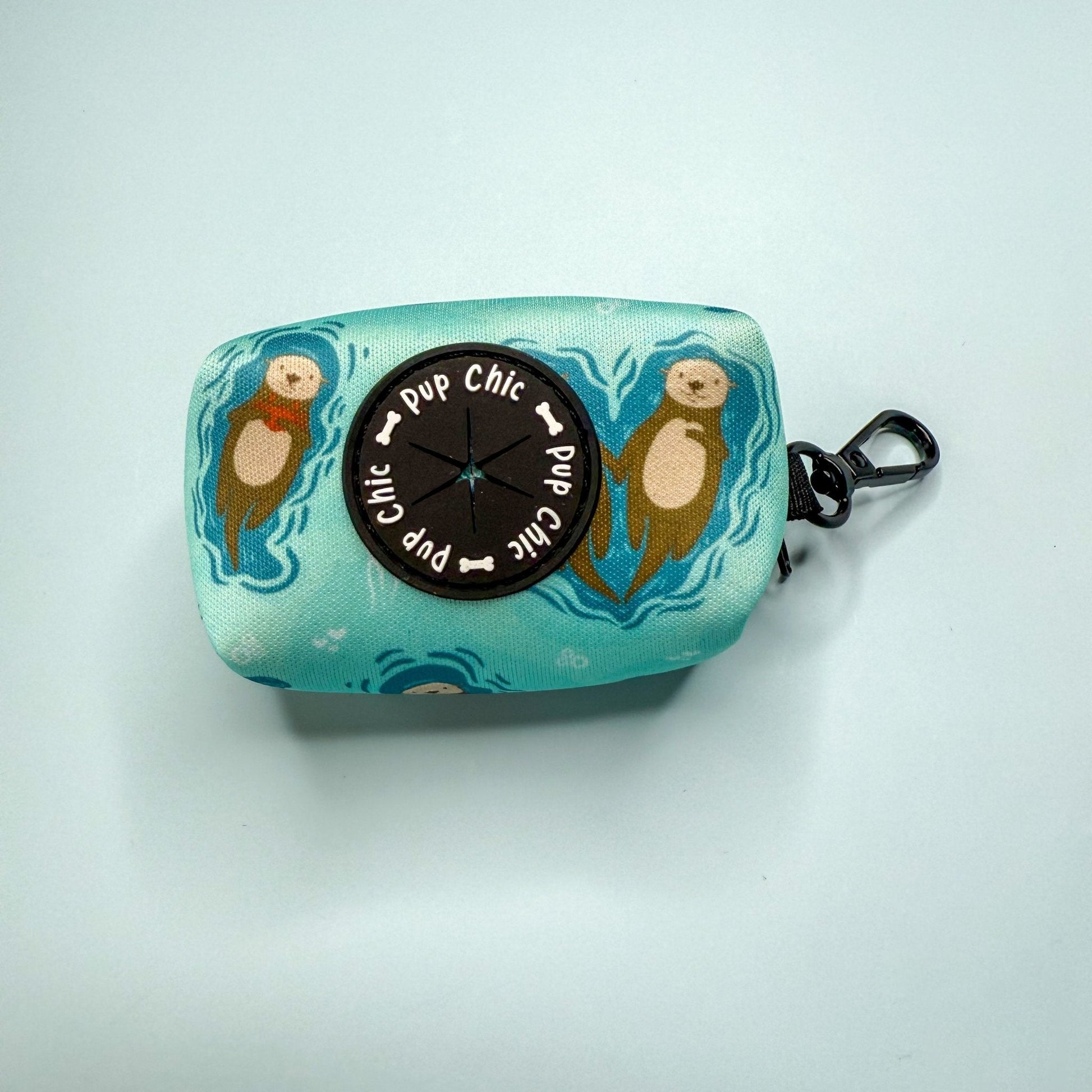 Otterly Lovely poo bag holder, compact water‑resistant design with otter print, clips to lead or belt