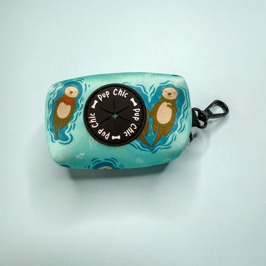 Otterly Lovely poo bag holder, compact water‑resistant design with otter print, clips to lead or belt