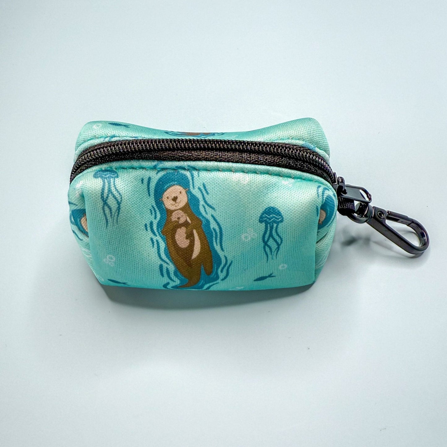 Otterly Lovely poo bag holder, compact water‑resistant design with otter print, clips to lead or belt