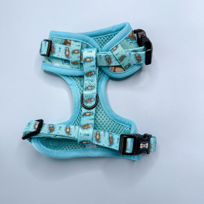 Otterly Lovely aqua step‑in dog harness with sea otter print, adjustable neck and chest straps