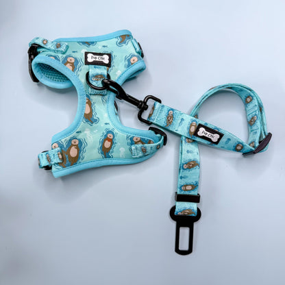 Otterly Lovely aqua step‑in dog harness with sea otter print, adjustable neck and chest straps