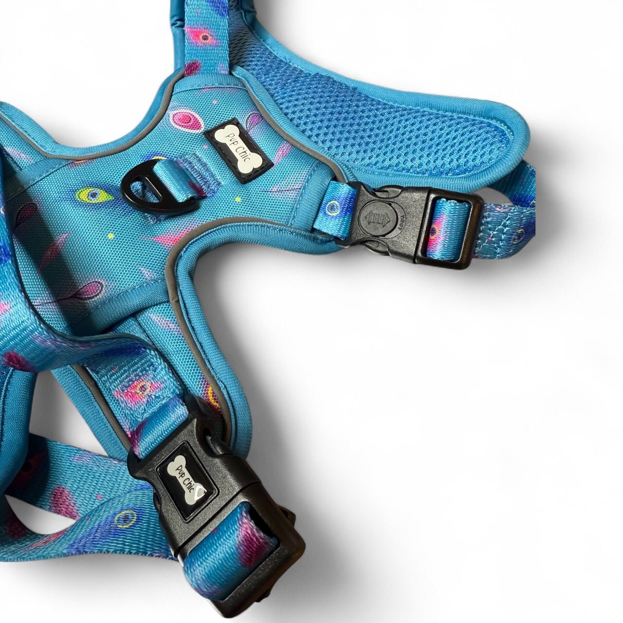Peacock Power tactical dog harness, teal base with peacock feather print, durable no‑pull design for strong dogs