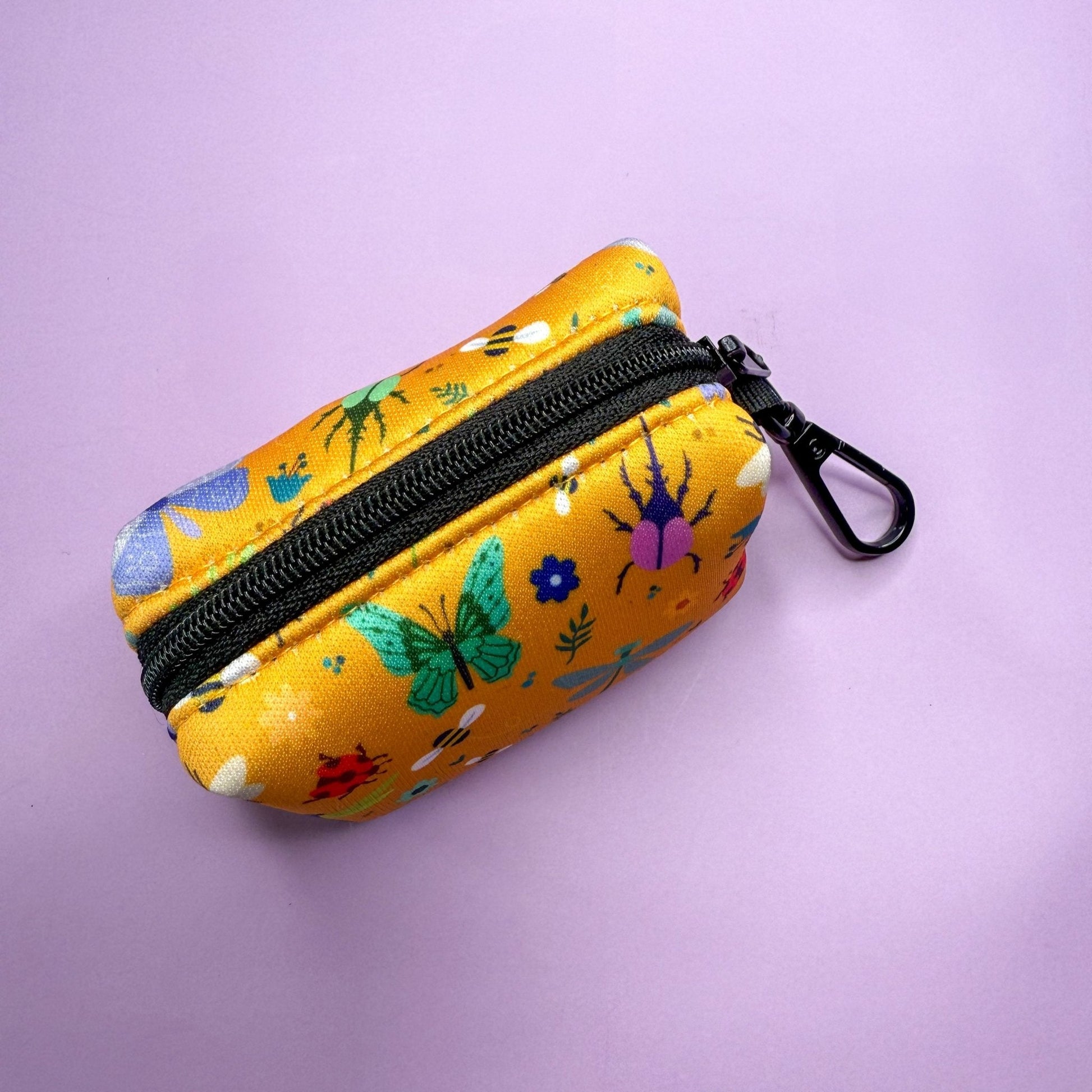 Summer Buzzin’ mustard yellow poo bag holder with bees, butterflies, moths & ladybirds print