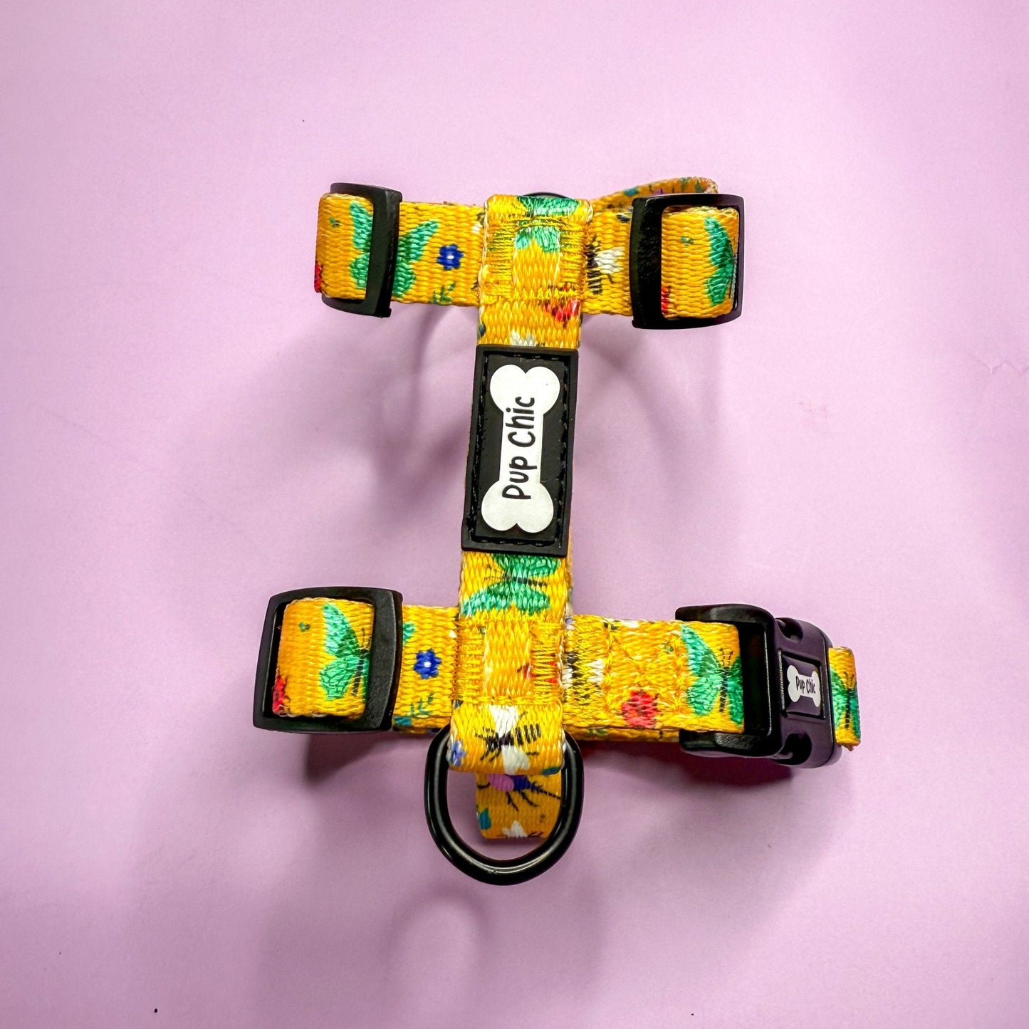 Summer Buzzin’ XXXS puppy harness in mustard yellow with colourful insect print, adjustable straps for tiny pets