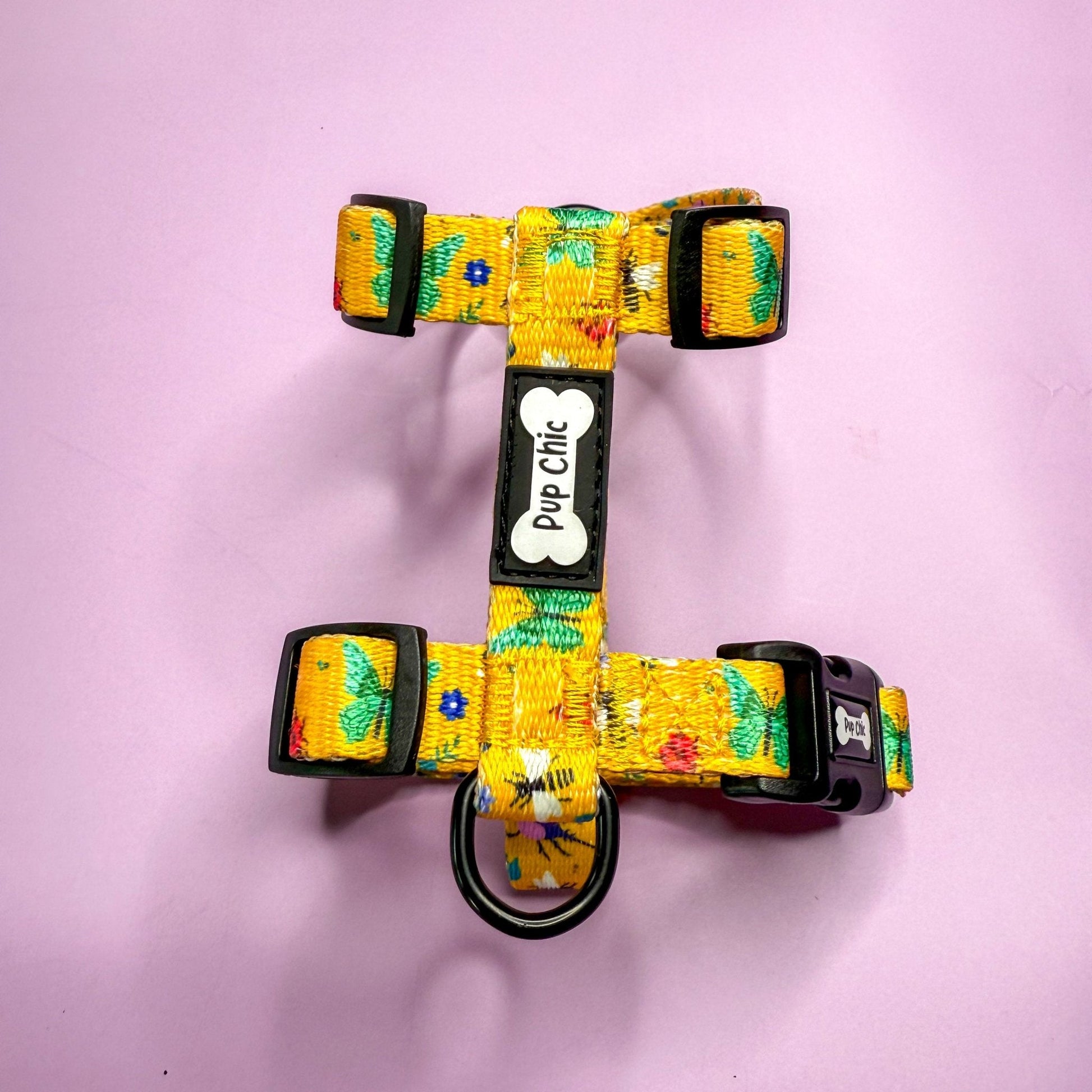 Summer Buzzin’ XXXS puppy harness in mustard yellow with colourful insect print, adjustable straps for tiny pets