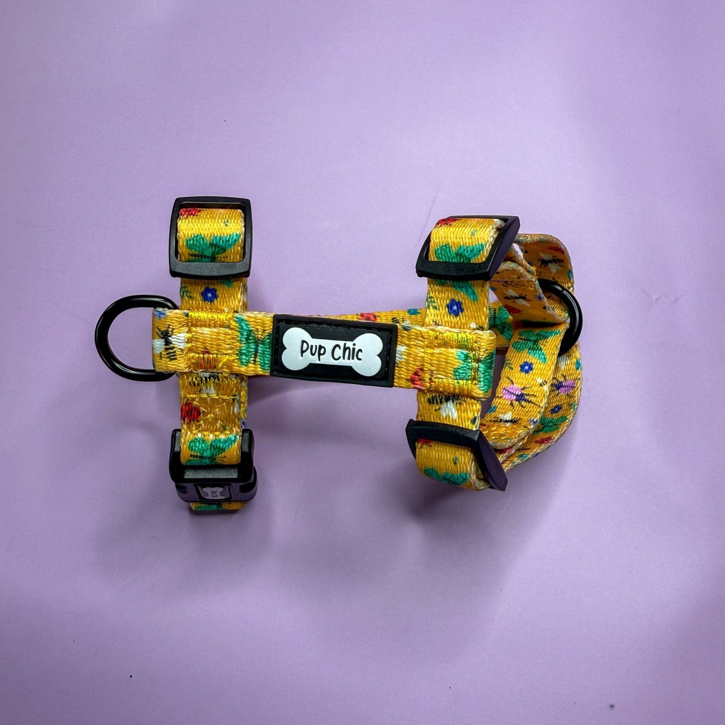 Summer Buzzin’ XXXS puppy harness in mustard yellow with colourful insect print, adjustable straps for tiny pets