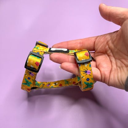 Summer Buzzin’ XXXS puppy harness in mustard yellow with colourful insect print, adjustable straps for tiny pets