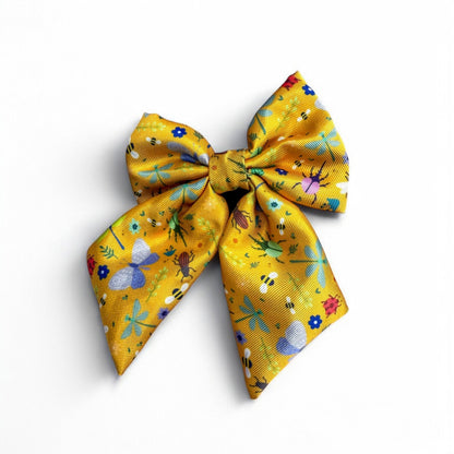 Summer Buzzin’ mustard yellow sailor bow with insect print, Velcro fastening, available in two sizes