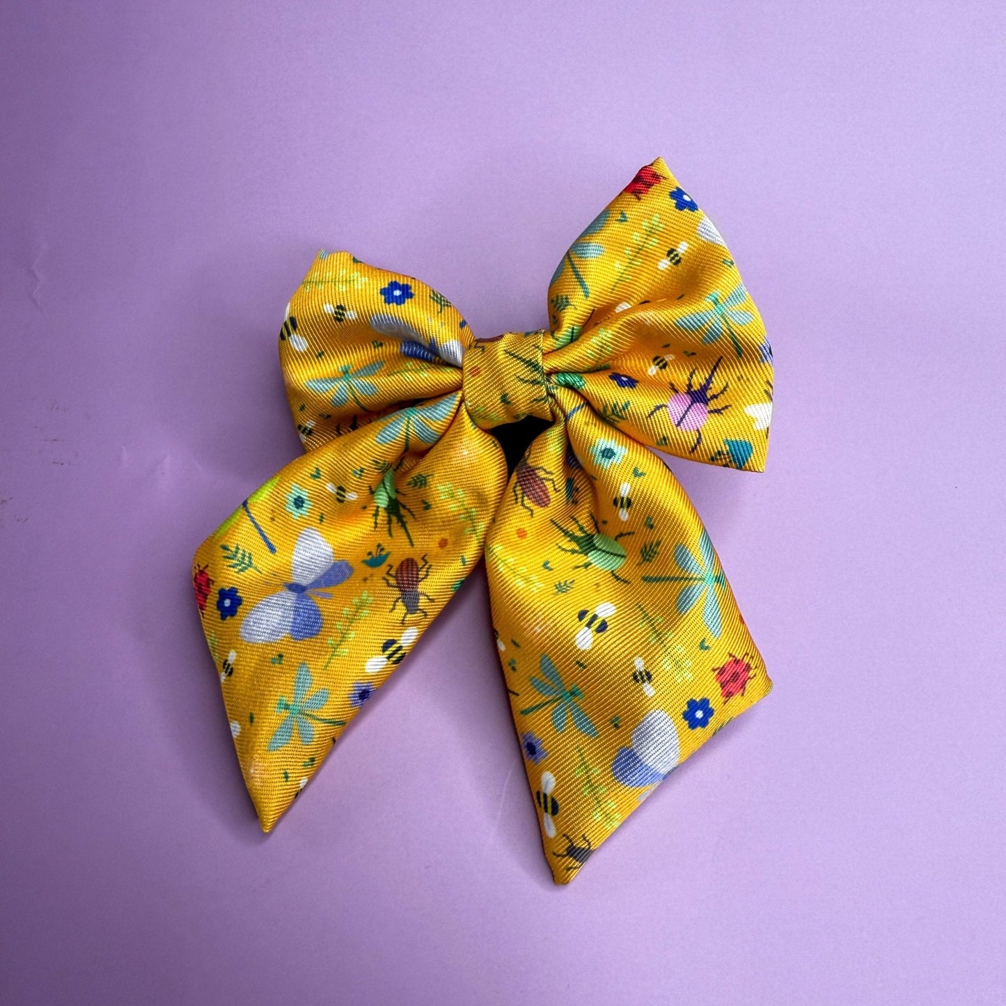 Summer Buzzin’ mustard yellow sailor bow with insect print, Velcro fastening, available in two sizes