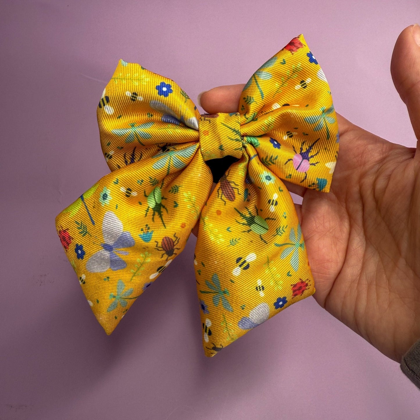 Summer Buzzin’ mustard yellow sailor bow with insect print, Velcro fastening, available in two sizes