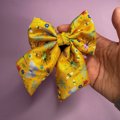 Summer Buzzin’ mustard yellow sailor bow with insect print, Velcro fastening, available in two sizes