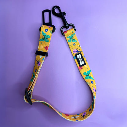 Summer Buzzin’ adjustable dog seat belt clip in mustard yellow with insect print